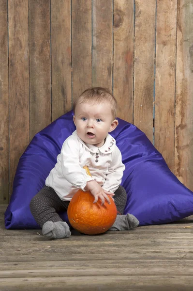 Baby with pumpkin — Stock Photo, Image