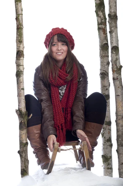 年轻的女子在雪橇 — 图库照片