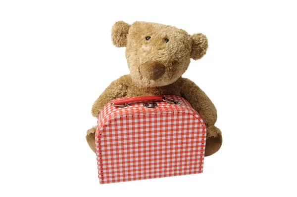 Teddybeer met rode en witte gecontroleerd koffer — Stockfoto