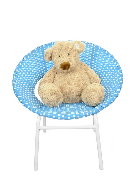 Teddy bear gezeten op een blauwe ronde stoel — Stockfoto