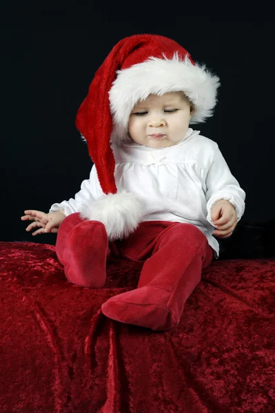 Little baby with christmas hat on black — Stock Photo, Image