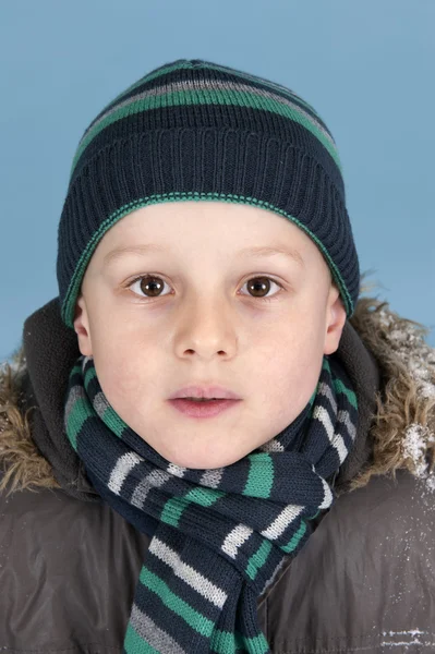 Portrait of young boy with knitted hat and scarf — Stock Photo, Image