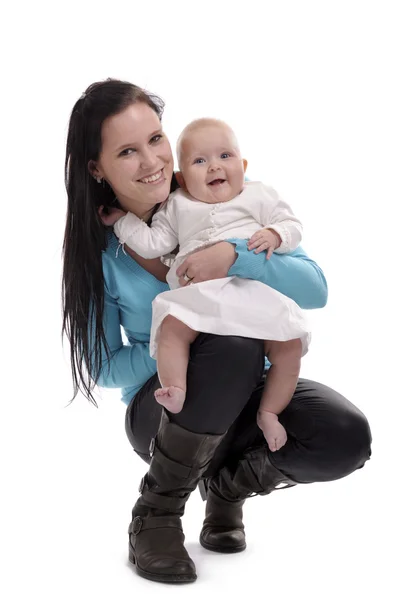 Young woman holding a baby — Stock Photo, Image