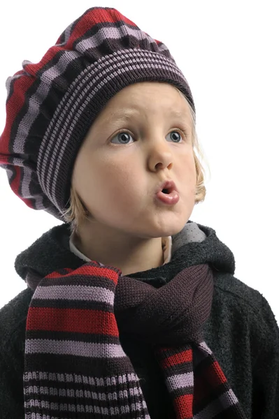 Little whistling girl with winter hat and shawl — Stock Photo, Image