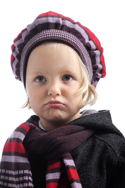 Unhappy little girl with winter hat and coat — Stock Photo, Image
