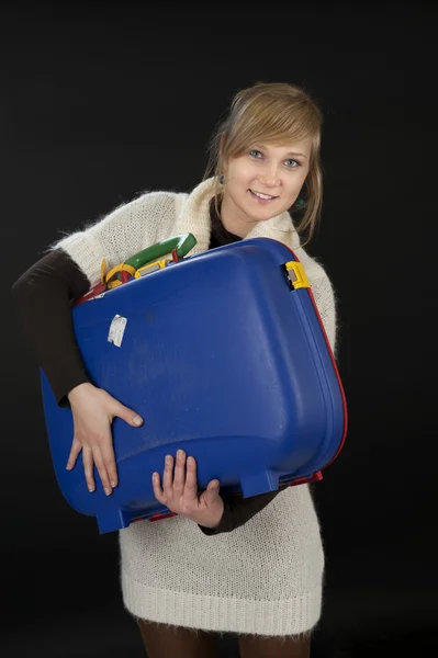 Young woman with suitcase on black — Stock Photo, Image