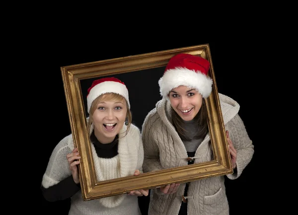 Two young women in a frame, — Stock Photo, Image