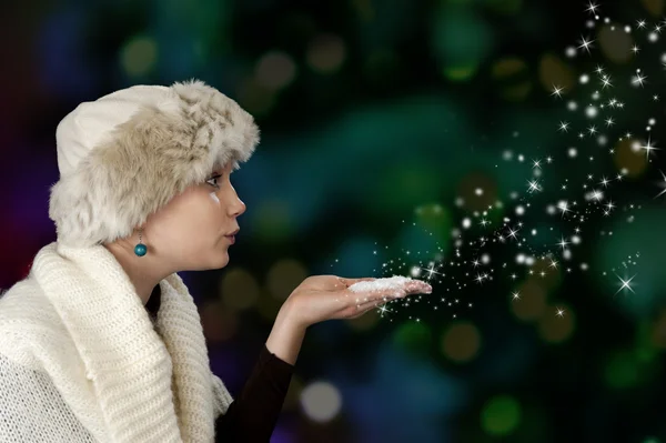 Young woman blowing snow — Stock Photo, Image