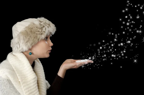 Young woman blowing snow — Stock Photo, Image