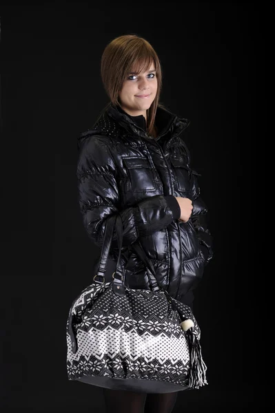 Teenager in black with big bag — Stock Photo, Image