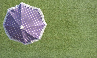 top view of parasol on grass field clipart
