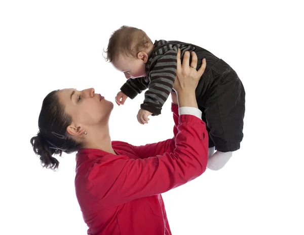 Mother holding her baby boy above her head — Stock Photo, Image