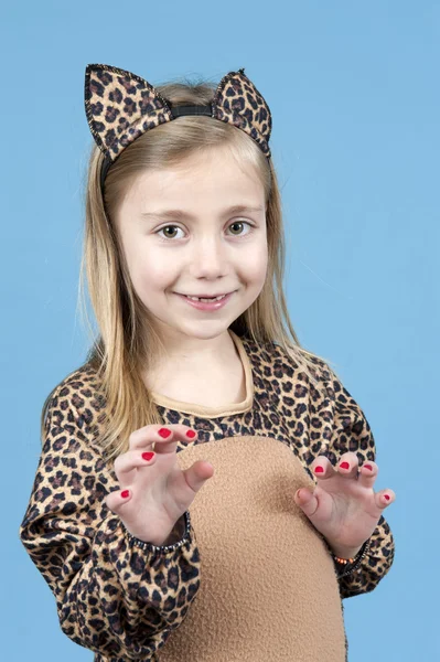 Little girl disquised as a leopard on blue — Stock Photo, Image