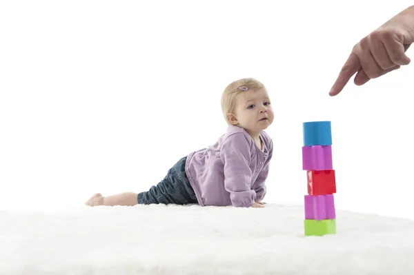 Happy crawling baby with colored cubes, isolated on white — Stock Photo, Image