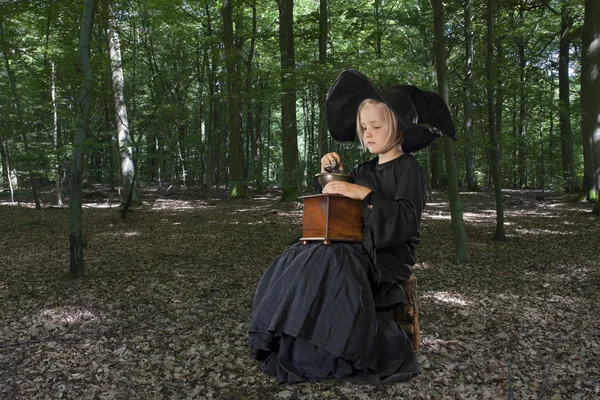 Halloween witch outdoors in the woods — Stock Photo, Image