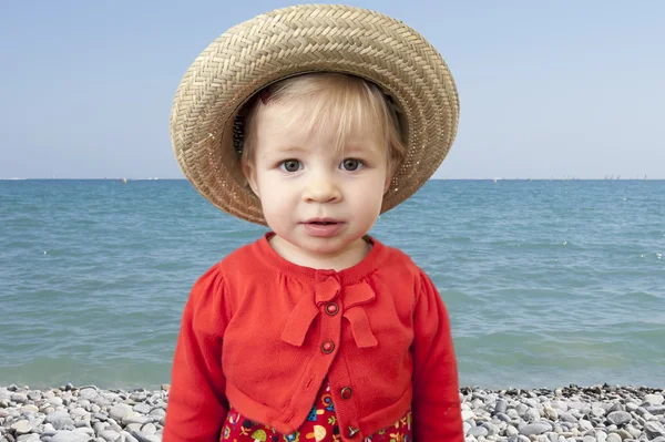Little toddler with summer straw hat — Stock Photo, Image