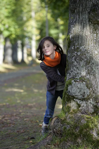 Little girl looking from behind — Stock Photo, Image