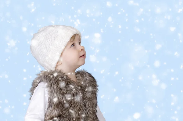 Little toddler looking up at the now falling down — Stock Photo, Image