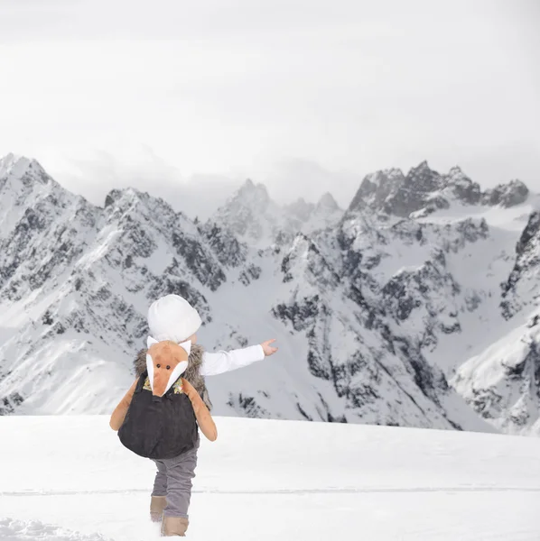 Little toddler outdoors in the snow in thealps Royalty Free Stock Photos