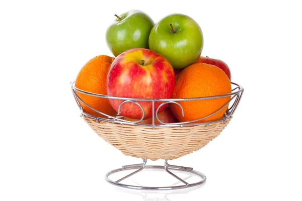 Bucket of red and green apples and oranges on white Stock Picture