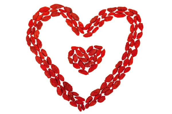 Goji berries heart shaped isolated on white — Stock Photo, Image