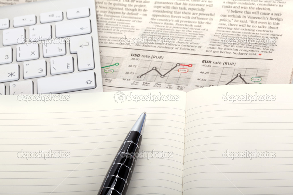 Business photo: fresh newspaper with stock index overview and op