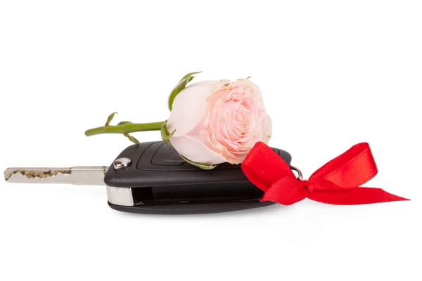 Car keys with ribbon and flowers as a gift isolated on white bac — Stock Photo, Image