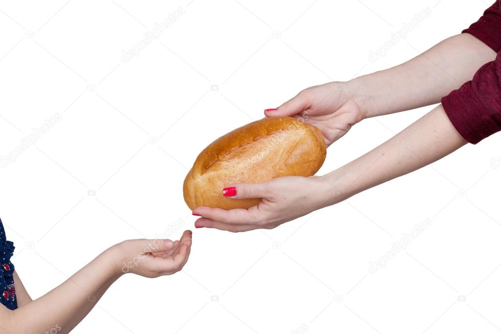 Child takes bread from mother's hands isolated on white backgrou