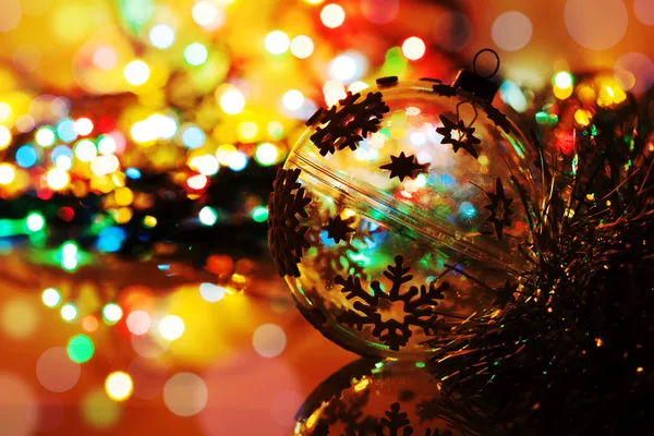 Colorful silhouette of christmas ball on new year's bokeh backgr — Stock Photo, Image