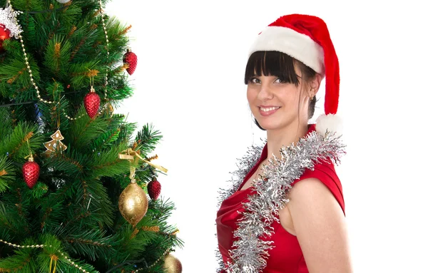 Jonge vrouw en kerstboom — Stockfoto