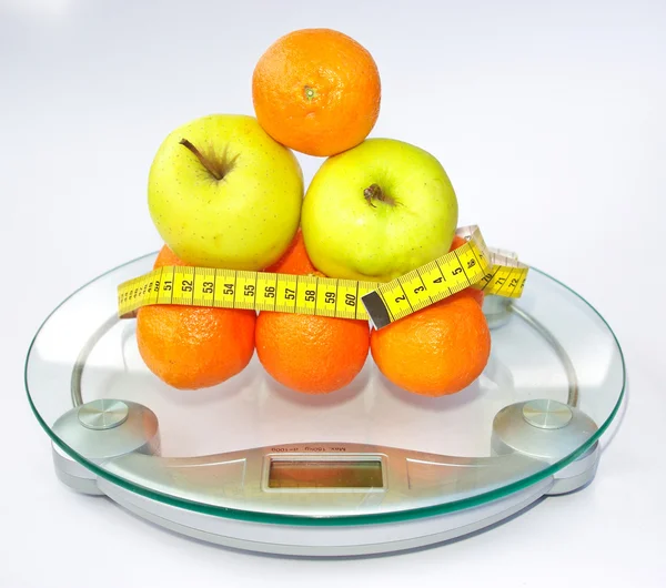 Fruits on scales — Stock Photo, Image