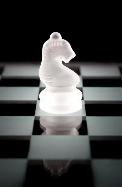 Knight chess piece over black — Stock Photo, Image