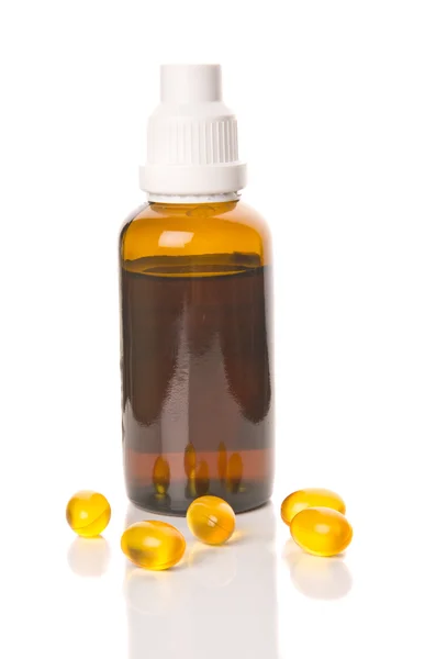 Bottlw med gult piller runt — Stockfoto