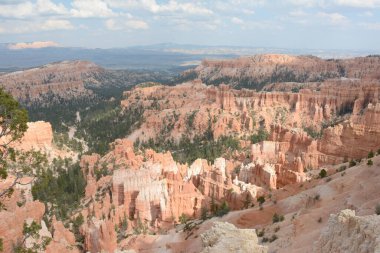 Partly shaded summer panoramic of scenic rock formations from Inspiration Point Vista at Bryce Canyon National Park, in southwest Utah. 