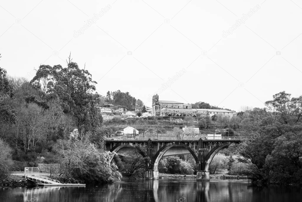 View of one of the bridges over the Lerez river in Pontevedra (Spain), with the church of San Benito de Lerez in the background.