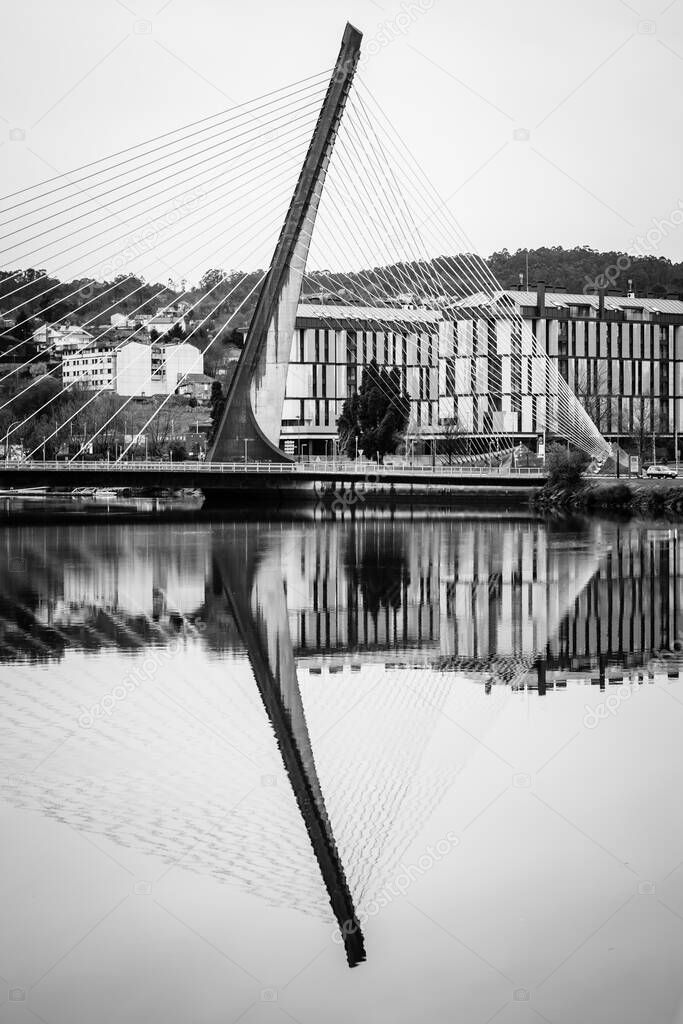 Suspended bridge over the Lerez river, which forms the Ria de Pontevedra, one of the estuaries that forms the Rias Bajas in Galicia (Spain)