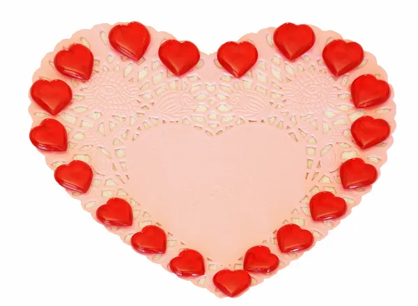 Corações vermelhos em um guardanapo rosa — Fotografia de Stock