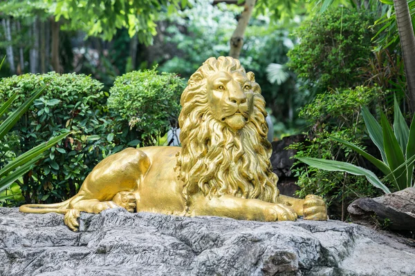 Yellow lion statue in garden