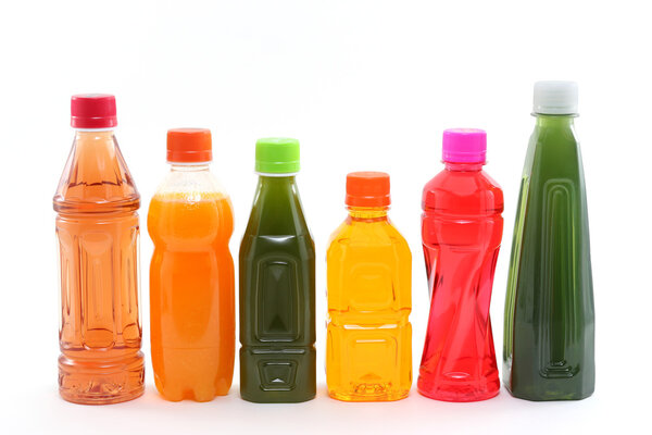 Bottles of Fruit Juices on White Background