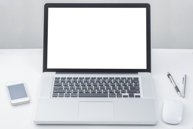Laptop computer on table with blank screen
