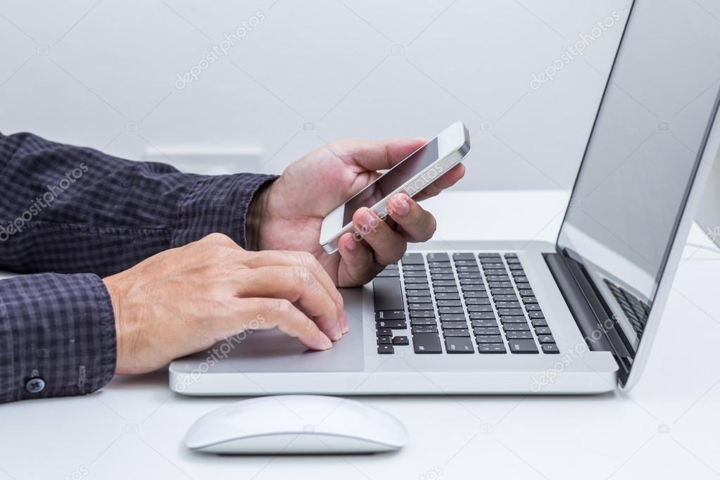 Man hand working on tablet with computer background. Technology.