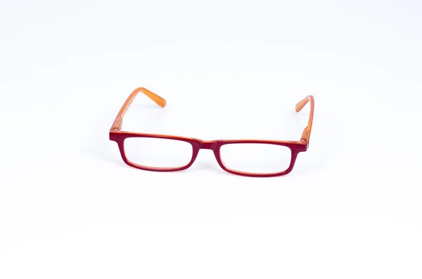 Оранжевые очки для чтения на белом фоне — стоковое фото