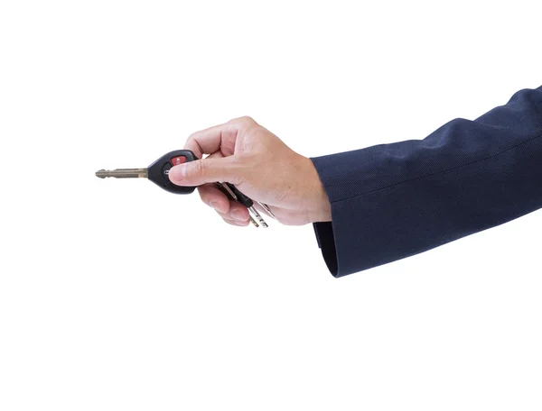 Uomo d'affari mano che tiene la chiave remota dell'automobile isolata sul retro bianco — Foto Stock