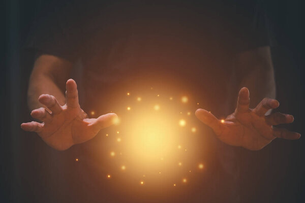 Man hands with magic glowing light. for product mock up