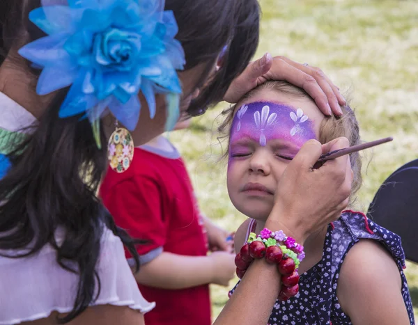 Make up artist painting young girls face — Stock Photo, Image