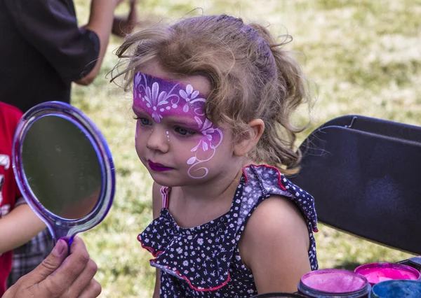 Young girl with her face painted like a princess Royalty Free Stock Images