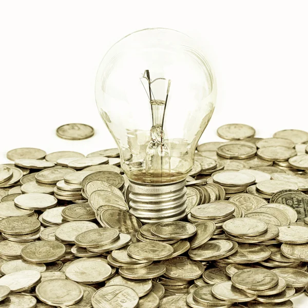 Lamp on coins — Stock Photo, Image