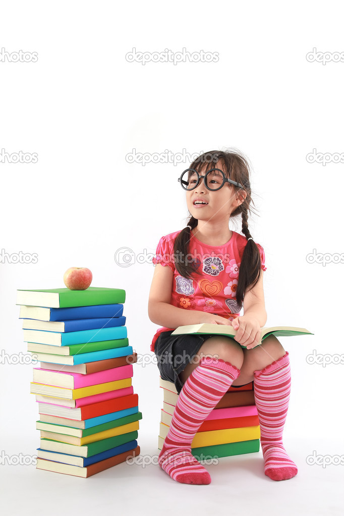 Student little asian girl reading the book