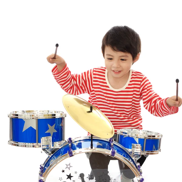 Asiático joven niño jugando azul tambor en blanco fondo — Foto de Stock