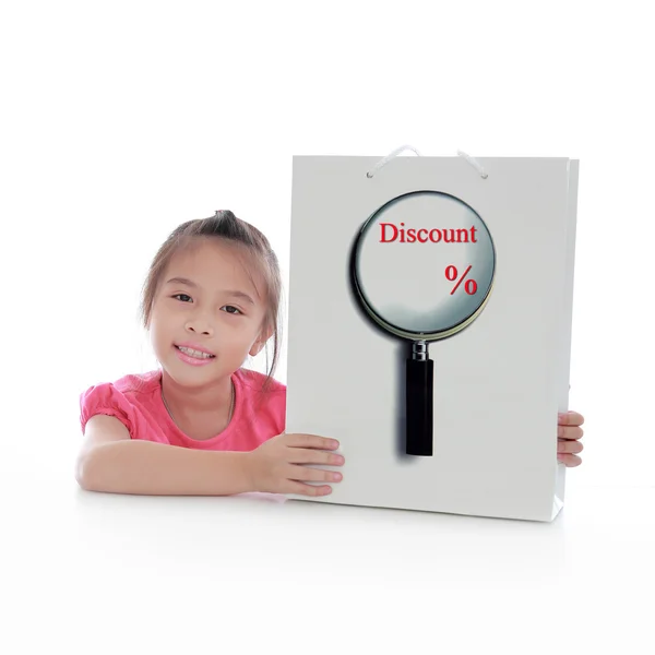 Happy little girl with shopping bag isolated white background — Stock Photo, Image